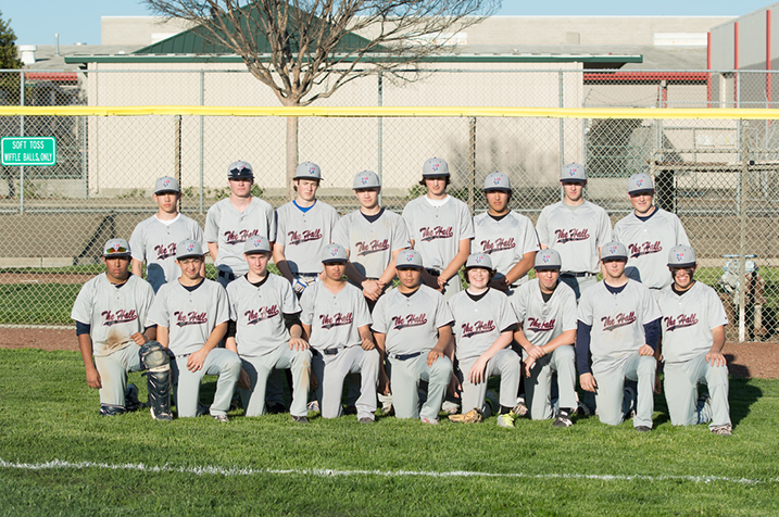 The baseball squad poses for a team photo after a game.
