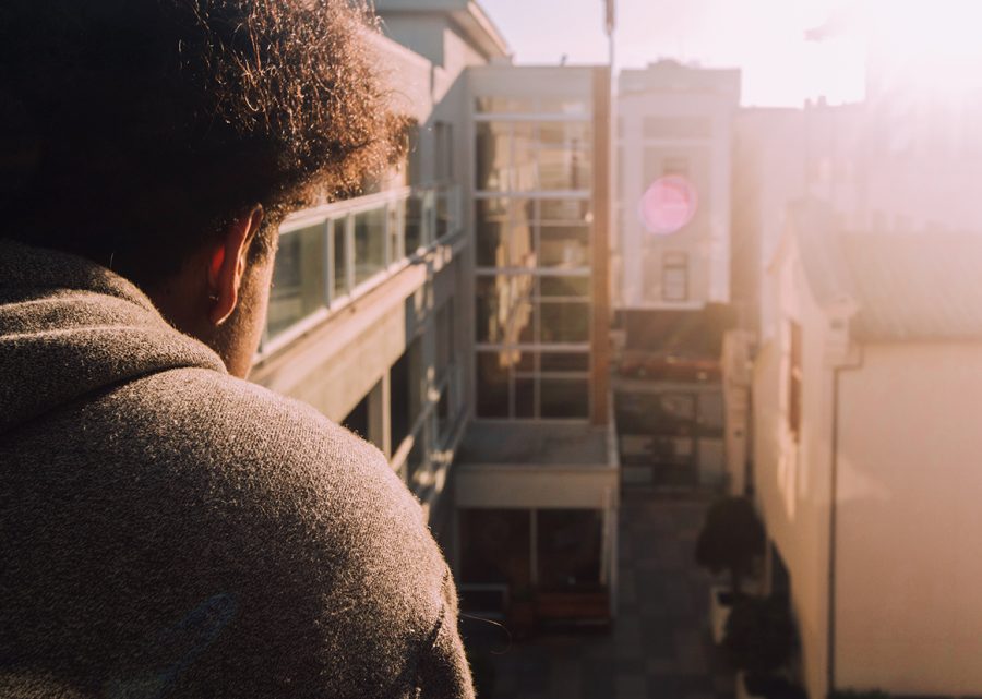 Jaden Newman ’17 looks over the courtyard at Stuart Hall High School early on a  March morning. Newman has recently begun to release music online and is seeing increasing success.