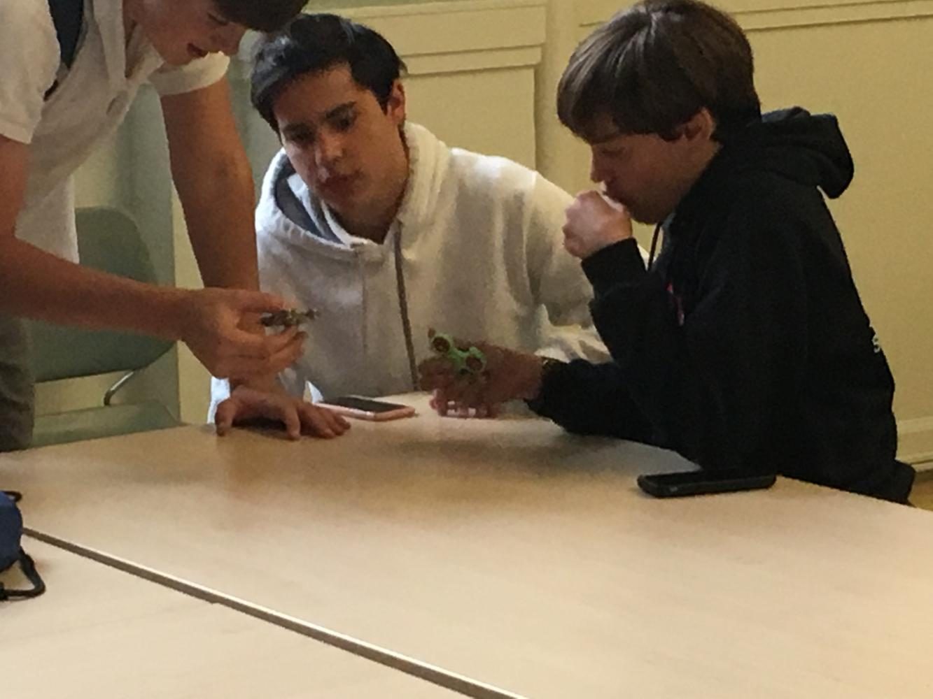 Student play with fidget toys during lunch. The toys have been beneficial for some students, but have also proven to be a distraction in the classroom.