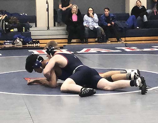 Captain Doug Dawkins wrestles with a Pinole Valley Spartan during a home match on Nov. 29. The Knights lost their first tournament of the season, but say they will focus on rebuilding the team by training promising underclassmen.