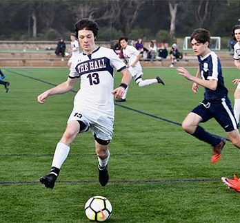 Junior Eamonn Kenny retains possession of the ball at Stuart Hall’s away game against the Urban School at Beach Chalet Soccer Fields on Jan. 16. Varsity ended the season 7-10-1, with players saying they hope to win at NCS.