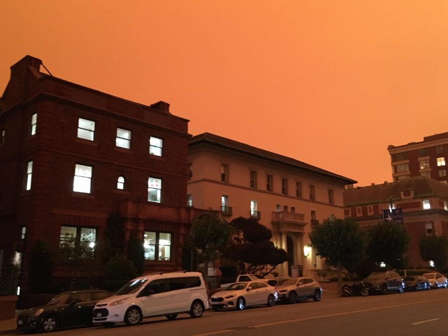 An orange sky and darkness hover around the buildings of the Broadway Campus during the morning of Sept. 9. Smoke from fires burning across California combined with Bay Area fog, forming a dark, orange sky and forcing many students and faculty to keep their lights on during the day. 