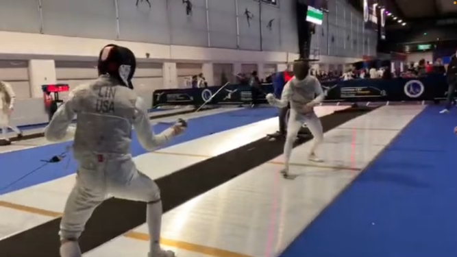 +Junior+fencer+Dashiell+Lin+takes+on+opponent+at+fencing+tournament.+Lin+fenced+at+the+World+Cup+and+will+be+fencing+in+the+Junior+Olympics+Feb.+2022.+