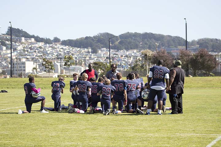 The Knights football team huddles up prior to the Homecoming game on Oct. 1. The Knights won its second straight league championship this season after finshing 5-0 in league play and 5-2 overall. Stuart Hall conceded the least amount of points in its league, and are looking to return many junior defensemen for a run at a third straight championship next year. 