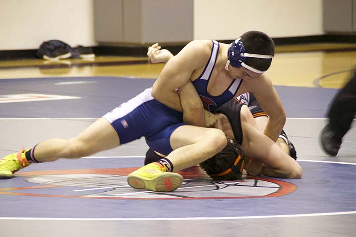 Jacob Hubbard ’17 executes a move while wrestling at Stuart Hall last winter. Hubbard and Alex McDonald '17 look to lead the wrestling team in their final season wrestling for The Hall.