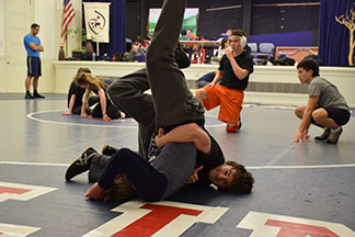 Lucas Horwitz ’19 executes a move during a wrestling practice.
The team competes Friday at the Bay Area Conference Championship.