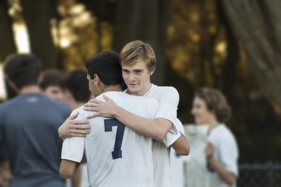 Freddy Kiaie ’18 (near) hugs Jack Honeyman ’19 following the Knights 4-0 loss to Urban last Friday at Beach Chalet. The Knights finished the regular season with a record of 9-2-3.