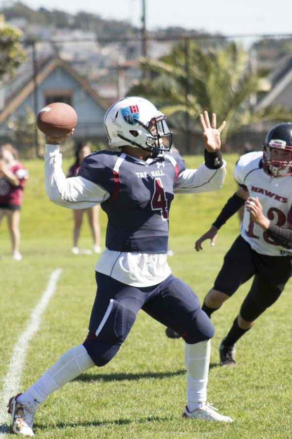 Jonathon Newsome ’19 attempts a pass during a game earlier in the season.  Newsome started every game at quaterback for The Hall this season.