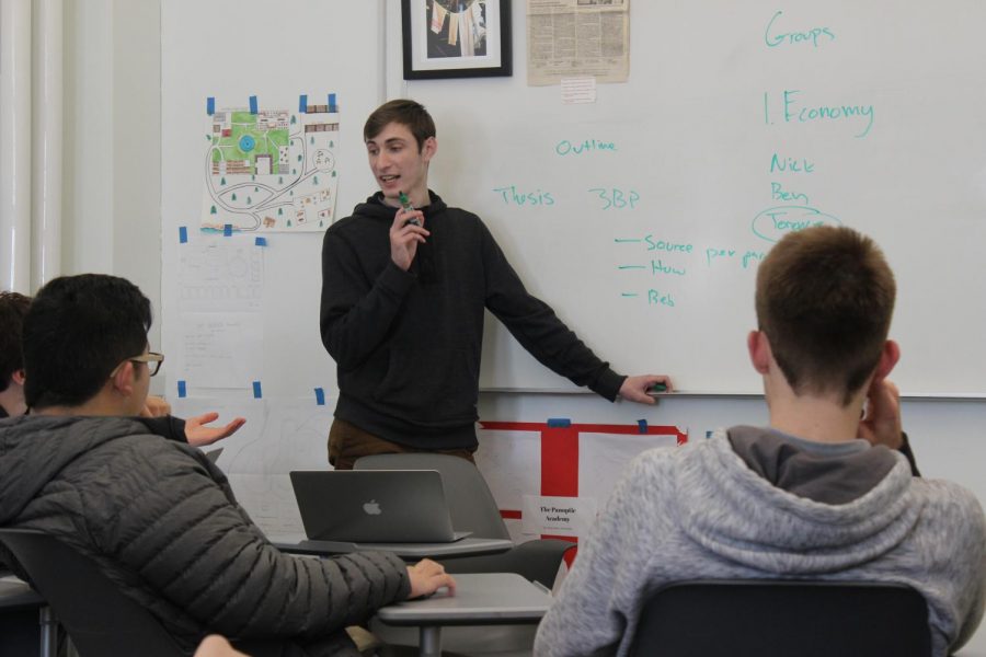 Jason Arzhintar ’19 teaches during the Theory of Knowledge class. Arzhintar
and his classmates have started a club to bring attention to events that
have fallen out of the news cycle or not received wide media attention.