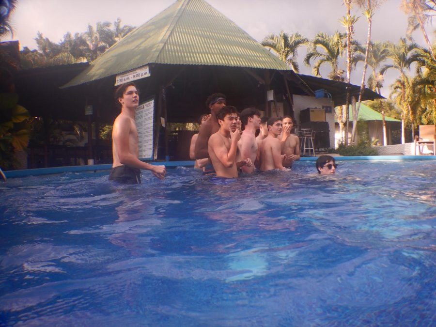 A group of sophomores prepare to play catch with a football at the Hotel Villas Rio Mar pool. After the morning activities, students ate lunch and had free time.