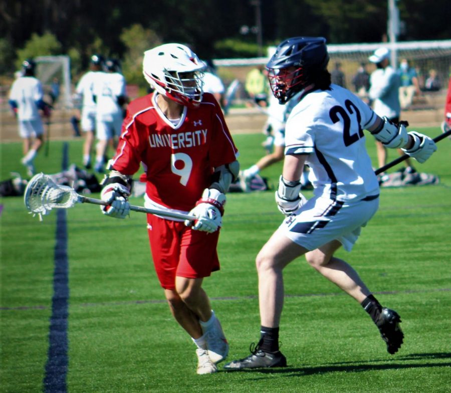 Senior Liam Walker plays defense against a University High School Red Devil at the lacrosse game on April 28, 2021.  Stuart Hall lacrosse defeated University 16-4 and placed second in the league.