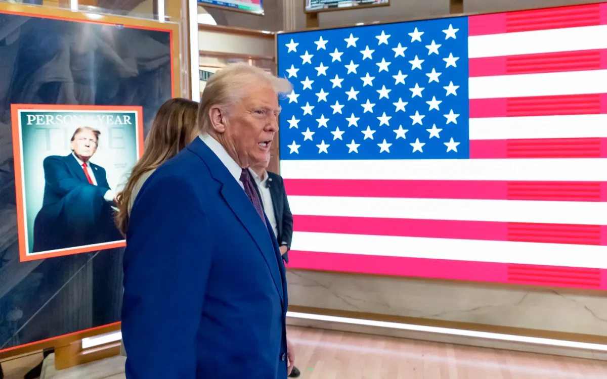 President Trump arrives on the floor of the New York Stock Exchange after being name Times "Person of the Year". The country still remains divided on optimism and fear regarding his upcoming second term.