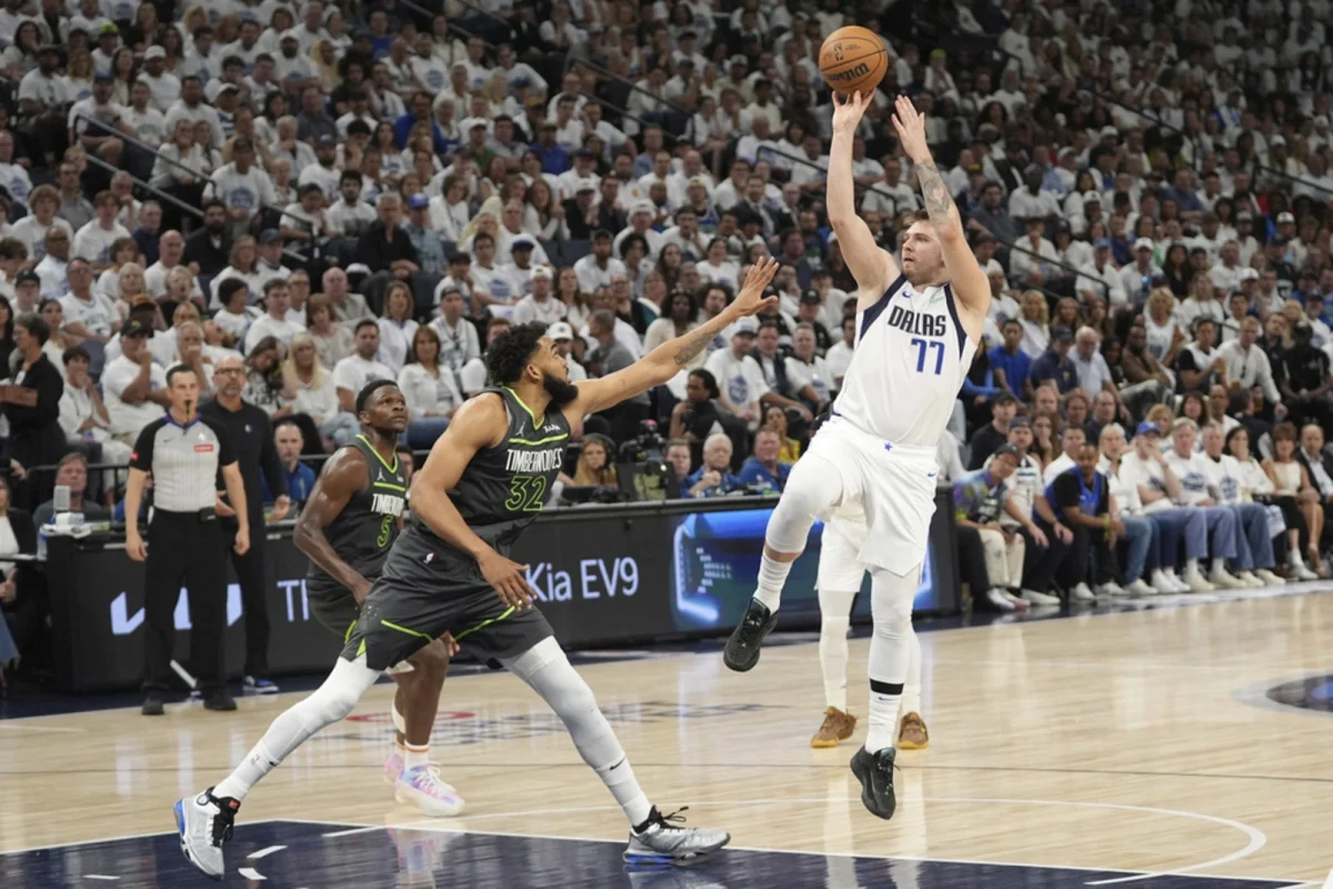 Luka Doncic, who was traded this week to the Lakers, hits three over Karl-Anthony Towns, who was traded to the Knicks a month before the start of the regular season. 