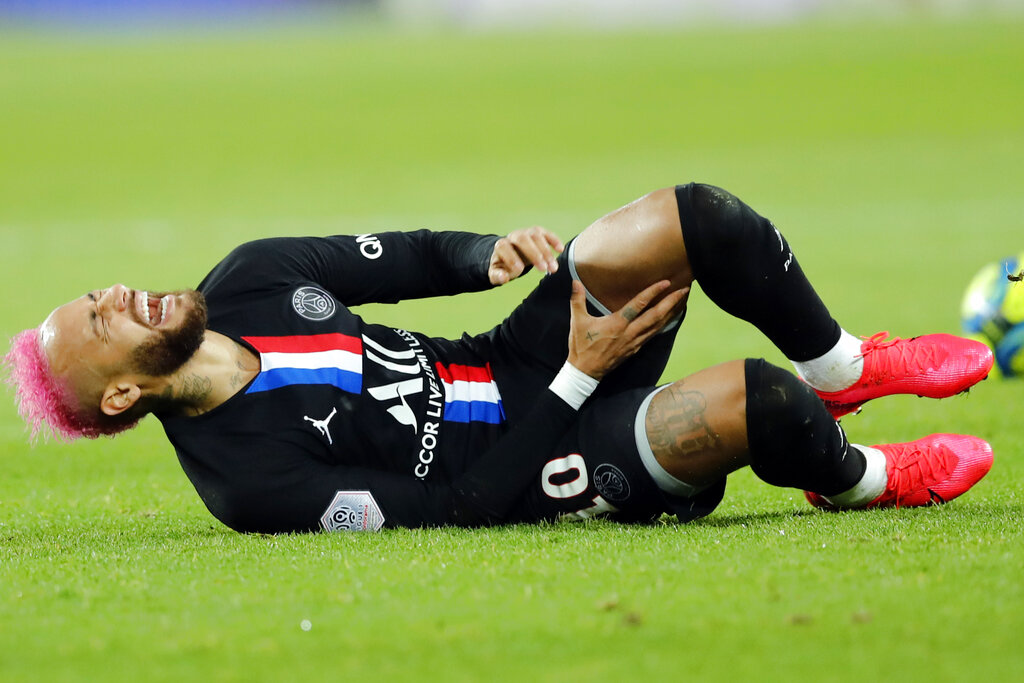 PSG's Neymar lies on the ground during the French League One soccer match between Paris-Saint-Germain and Montpellier at the Parc des Princes stadium in Paris, Saturday Feb. 1, 2020. 