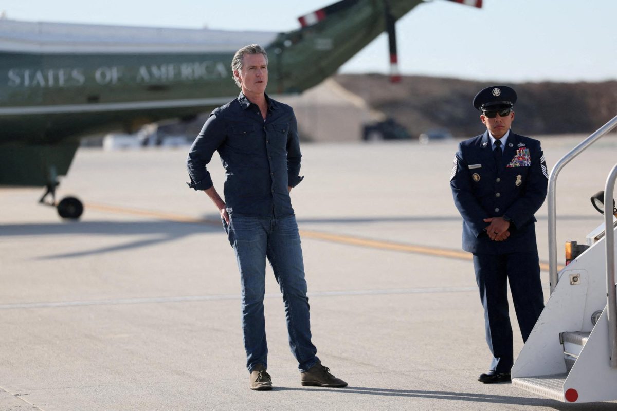 Governor of California Gavin Newsom waits for U.S. President Donald Trump, who arrives to tour areas impacted or destroyed by the southern California wildfires, at Los Angeles International Airport in Los Angeles, California, U.S., January 24, 2025.