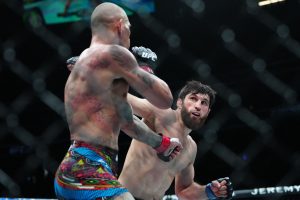 Mar 8, 2025; Las Vegas, Nevada, USA; Alex Pereira (red gloves) fights Magomed Ankalaev (blue gloves) during UFC 313 at T-Mobile Arena. Mandatory Credit: Stephen R. Sylvanie-Imagn Images