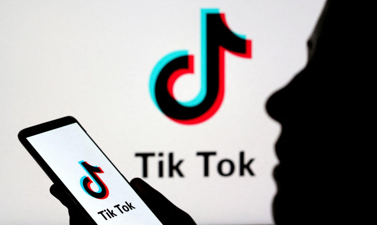 A person holds a smartphone with the Tik Tok logo displayed in this picture illustration taken November 7, 2019.