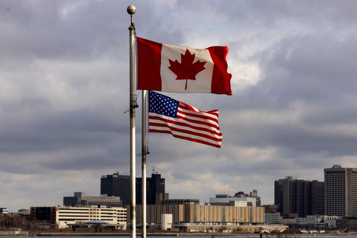 Flags wave in the wind across from Detroit, Michigan, U.S., in Windsor, Ontario, Canada February 4, 2025.