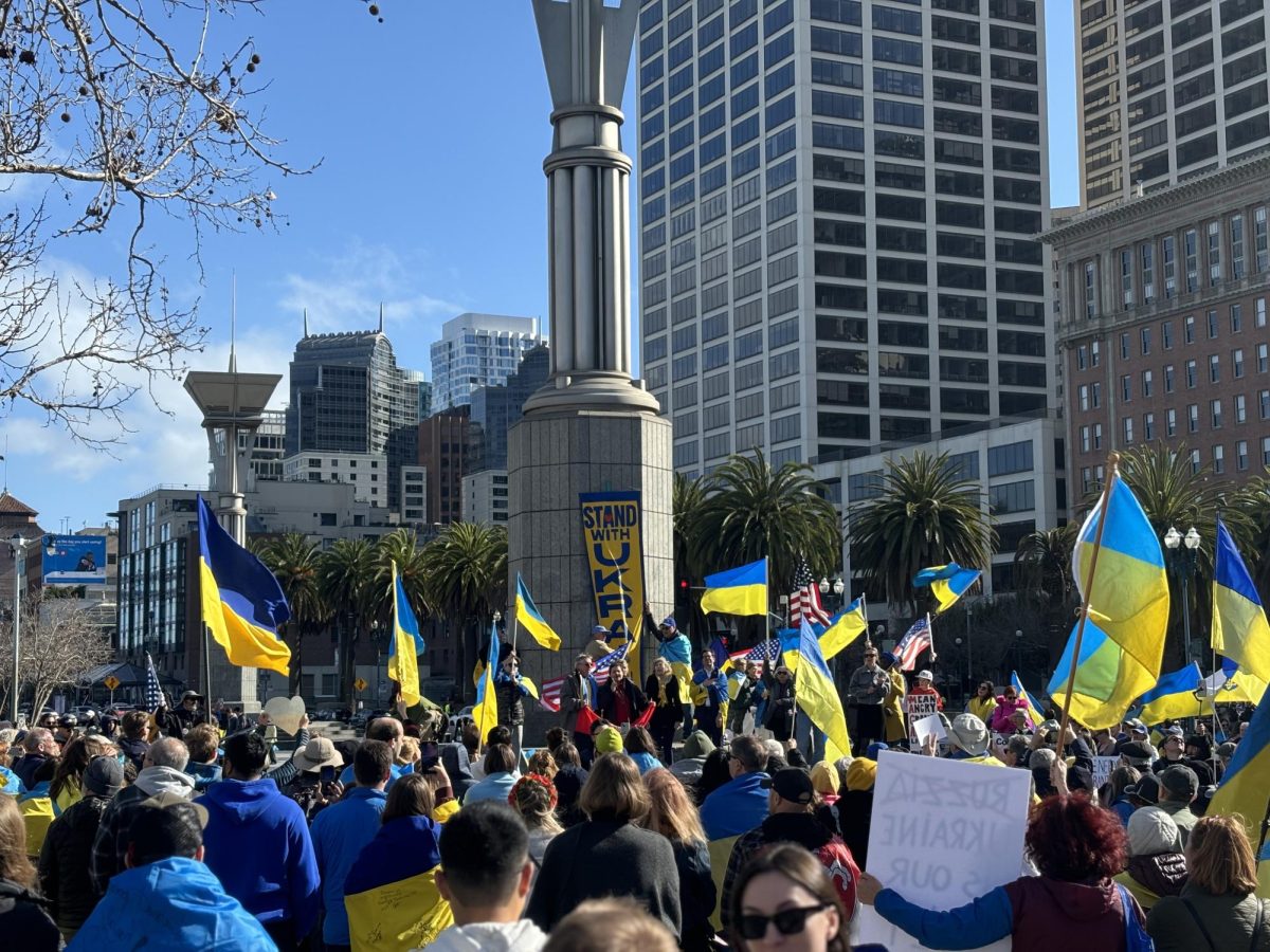 Demonstrators at Harry Bridges Plaza in San Francisco show support for Ukraine following a confrontational press conference in the Oval Office between President Zelensky and President Trump.