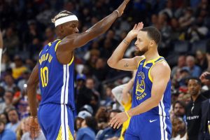 Apr 1, 2025; Memphis, Tennessee, USA; Golden State Warriors forward Jimmy Butler III (10) reacts with guard Stephen Curry (30) during the fourth quarter against the Memphis Grizzlies at FedExForum. Mandatory Credit: Petre Thomas-Imagn Images