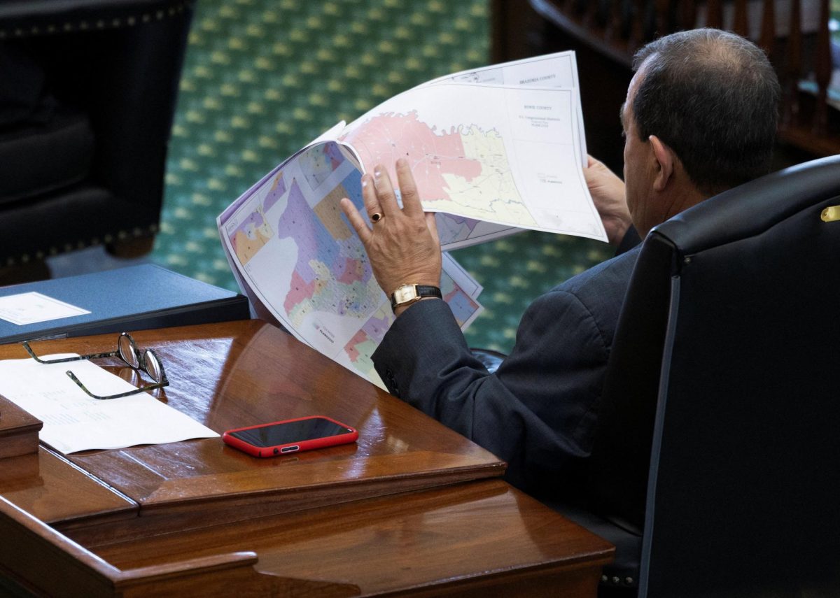 Republican State Senator Pete Flores looks over redistricting maps as the Republicans attempt to pass a bill that would redraw the state's 38 congressional districts, at the Texas State Capitol in Austin, Texas, U.S. August 22, 2025. REUTERS/Nuri Vallbona