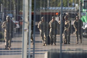 National Guard members walk at the U.S. Immigration and Customs Enforcement (ICE) Broadview facility in Chicago, Illinois, U.S., October 9, 2025. REUTERS/Jeenah Moon